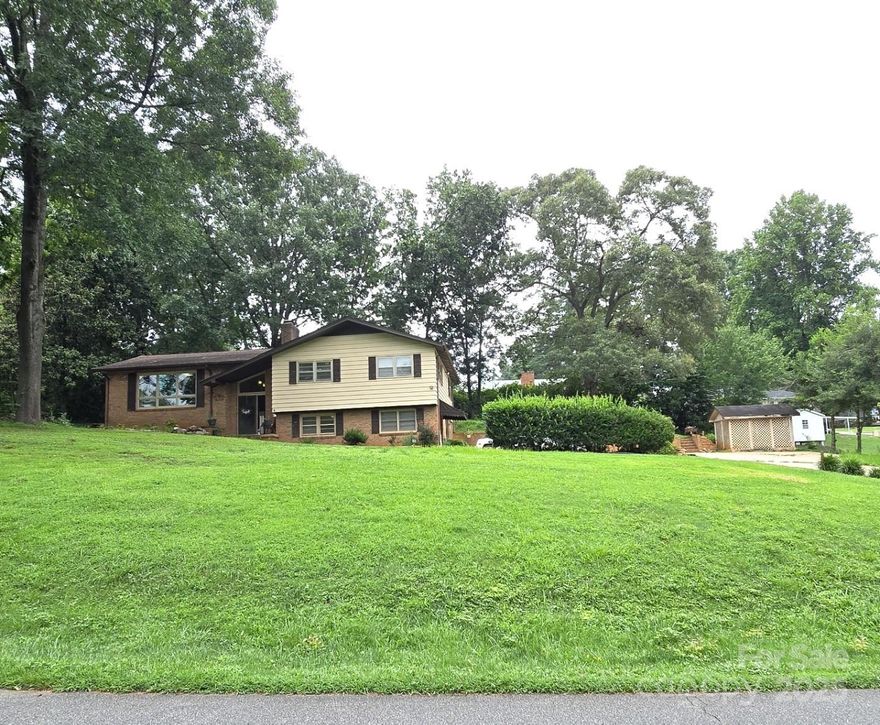 NEW PRICE!!!! This charming 3-bedroom, 2½-bath split-level home sits on a combined 0.79 acres (0.53-acre main lot plus 0.26-acre adjacent parcel) in a quiet Hickory neighborhood. The multi-level layout offers comfortable living spaces, perfect for relaxing or entertaining, while the expansive yard provides room for gardening, play, or outdoor gatherings. The finished basement feels like a whole new individual apartment. The house is located about 4 miles from downtown Hickory, so you’ll enjoy a quick access to shops, restaurants, and cultural attractions while still savoring a peaceful residential setting.

Nearby, you’ll find Lake Hickory for boating and fishing, Baker’s Mountain Park with scenic hiking trails, and cultural gems like the Hickory Museum of Art and Catawba Science Center. Dining options abound—from cozy cafés to local favorites to convenient shopping. This home blends space, location, and lifestyle into one inviting package.