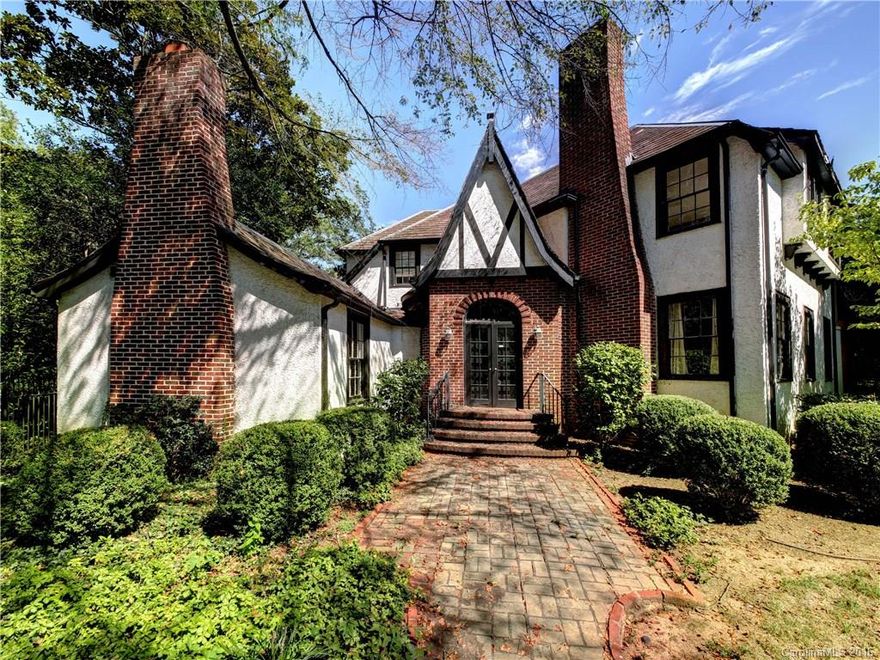 Prominent Tudor Revival in the heart of Myers Park. Designed by Martin Boyer and built in 1925. High ceilings, beautiful hardwoods. Updated kitchen with granite, stainless appliances and more. Guest cottage has kitchenette and full bath. All inspections available on MLS attachments.  Home sold in present condition or seller would consider remodeling for a Buyer.  Tons of potential.  Sealed crawl.  Great location and large lot.