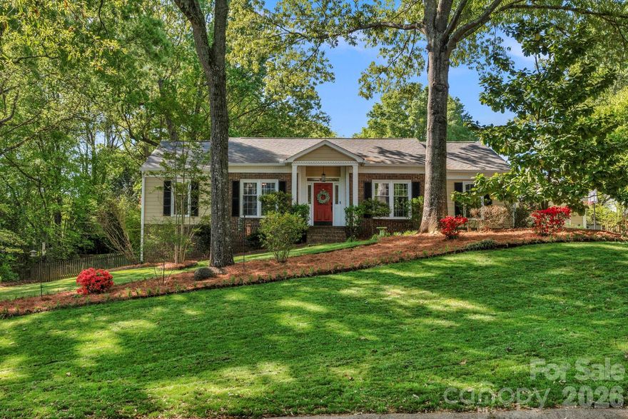 Nestled on a picturesque, tree-lined lot, this classic ranch home offers a warm and inviting atmosphere with a layout designed for comfortable, everyday living. Step inside to a welcoming foyer that opens into a bright and airy living space, highlighted by oversized windows and a stylish barn door leading to a versatile office or guest area. The family room features a vaulted ceiling and cozy fireplace, seamlessly connecting to the kitchen and dining area while maintaining distinct spaces for gathering and entertaining. Luxury vinyl plank (LVP) flooring runs throughout the main living areas, complemented by wooden blinds, updated lighting, and new switches and outlets for a clean, modern touch. The thoughtfully designed bedroom layout ensures privacy, including a spacious primary suite with its own bath, along with two additional carpeted bedrooms for added comfort. Step outside to enjoy an oversized patio overlooking a fully fenced backyard, both private and generously sized, perfect for relaxing or entertaining. Major updates provide peace of mind, including a new roof, gutters, and downspouts (2024), HVAC system (2024), updated fuse box, and a new dishwasher (2025). An oversized two-car attached garage adds everyday convenience, and features additional attic storage above garage with pull- down access. Residents will also enjoy fantastic neighborhood amenities such as a pool, sports courts, playgrounds, and an athletic field—all just minutes from shopping and dining. This well-maintained home is move-in ready and waiting for you—don’t miss your chance to make it yours!