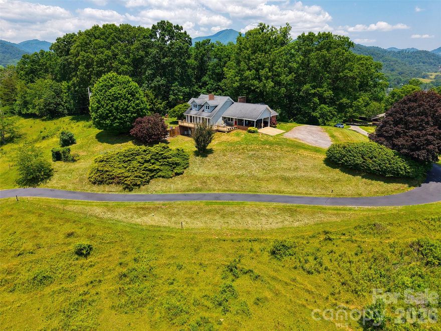 EXCEPTIONAL VIEW Home offers one of the best 360-degree views of the mountains, stunning overlooking the layered mountains and Valley of Iron Duff. Enjoy easy access to this property with a smooth, direct drive- no difficult or windy roads just off state maintained roads. Inside, you'll find plenty of space for living and entertaining, complemented by four wood burning fireplaces and expansive picture windows that frame the breathtaking vistas. The home features a beautifully remodeled kitchen with a cozy sitting room just off it, ideal for relaxing or casual meals. There are four comfortable bedrooms, along with several flexible rooms that can be tailored to your needs. A full basement provides even more potential living or storage space. Additionally, there is additional land and outbuilding on the that property which offers versatile possibilities and could be adapted to suit a variety of purposes, such as a workshop, chicken coop, or barn.