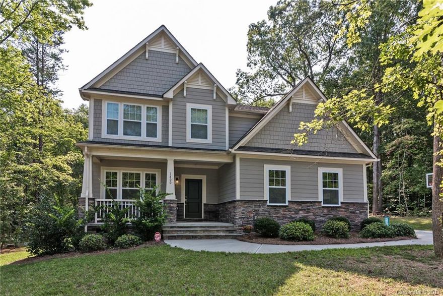 Hard to find wooded one acre lots in beautiful Waxhaw area. Private office, media room and 4 bedrooms.  Upgrades include gourmet kitchen w/gas top, double ovens and upgraded cabinets, hardwood throughout main floor and entire staircase, Jack-n-Jill upstairs bath, 3 car side load courtyard garage, equipment in media room will stay as pictured with strong offer. Mineral Springs Greenway surrounds the neighborhood for nature and horse lovers. Price Reduction! Come Visit today and make it home!