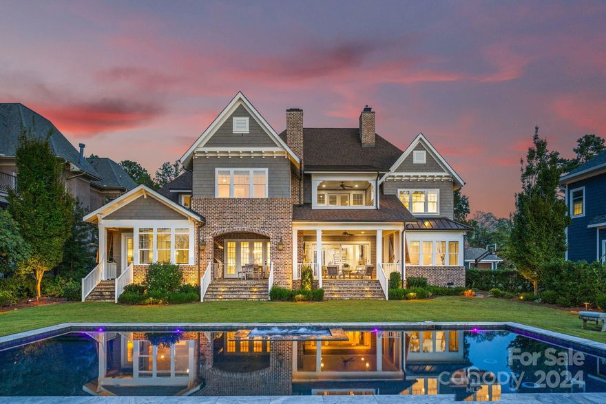 Experience unparalleled luxury in this custom-built masterpiece w/ its prime waterfront location on Lake Norman. Boasting 7 spacious bedrooms & 6 full baths w/ primary on main level, this home showcases an array of designer features. In addition to the well appointed bedrooms & bathrooms, you'll find convenience in the multiple laundry rooms, guest suite over garage & a bonus room w/ built in bunk beds. This thoughtful design ensures comfort & flexibility for all your lifestyle needs.This waterfront paradise offers the ultimate retreat from the gourmet kitchen boasting all high end Jenn-Air appliances to the expansive outdoor living area, lush backyard & gleaming swimming pool. No detail has been spared in the creation of this exquisite home. Enjoy direct lake access with a private dock for your water adventures & savor the breathtaking sunset views daily. Every inch of this property exudes opulence and tranquility, making it a must-see for those seeking the finest in lakeside living!