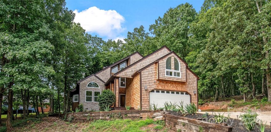 Welcome home where this living space and every corner of this home has been meticulously touched to create a truly luxurious experience. You'll be greeted by crown molding throughout, oak flooring, and custom lighting. Two-story great room boasts floor-to-ceiling windows with tons of natural light. In the kitchen, the large wrap-around island w/ granite countertops. Fully equipped with stainless steel appliances, lots of cabinetry, and wet bar. The primary bedroom features high ceilings and a palladium window that opens up the space. The ensuite features a double vanity sink, spacious shower with dual rainfall shower heads, and a timed jacuzzi soaking tub along w/ a built-in heater in the bathroom vent. Step outside and discover a wrap-around deck. The deck features built-in solar lights and a fire pit. The large lot adorned with mature trees, provides plenty of privacy. This home is a true sanctuary, providing a slice of serenity away from the hustle and bustle of city life.