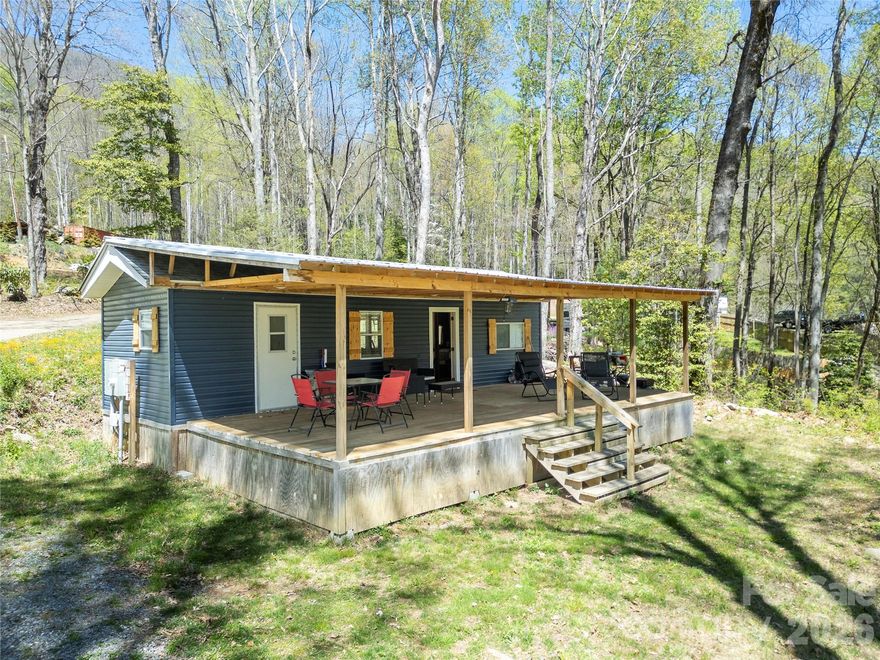 Turnkey mountain getaway with short-term rental potential—fully furnished and ready to go.

Tucked into a quiet, wooded setting in Maggie Valley, this Chariot Eagle park model (approx. 33x12) on deeded land offers a rare opportunity for a low-maintenance retreat, investment property, or personal escape. With 2 bedrooms plus additional bunk space, a 2-bedroom septic (2022), and 1 full bath, the layout is designed to comfortably accommodate guests while maximizing usability.

Major updates have already been completed, including a 2-ton heat pump (2022), updated electrical throughout with 200 amp service, and a metal roof (2022). The home sits on a permanent foundation with a full Certificate of Occupancy.

A private well is scheduled for installation in May 2026, and Spectrum high-speed internet is available—making this a strong option for both personal use and short-term rental guests.

Offered fully furnished, this is a true turnkey opportunity—just bring your plans and start enjoying or renting right away.

Located minutes from Maggie Valley, with easy access to the Blue Ridge Parkway, Cataloochee Ski Area, and Cherokee, this property is central to some of the area's best access points.