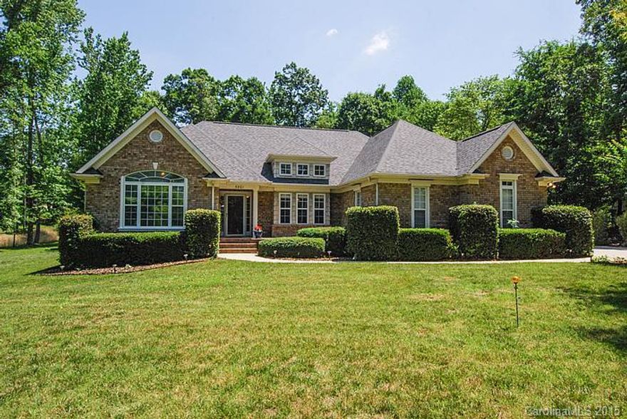 Gorgeous custom build home 3 sides brick on large private wooded lot. Wonderful open floor plan featuring split bedrooms adjoined by main living area. High ceilings, French doors, wood burning fireplace, large windows offering an abundance of natural light, beautiful eat in kitchen featuring corian counters and tile back splash. Large laundry room, garden tub in master, 2 car side load garage, beautiful landscaped yard. Great flow for entertaining inside and out, close to many amenities.