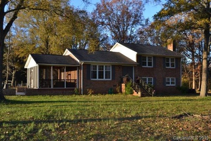 Fabulous home situated on a large 8.14 acre lot! This tri-level is located near Mcconnells and features beaufitul hardwoods throughout main living areas and all bedrooms.  Open layout from formal living room to the cute kitchen w/ cozy dining room!  Three spacious bedrooms on the main level, extra great room w/ wood burning FP on lower level w/ spare bedroom.  Huge screened porch, patio, and detached garage/ workshop.  Country living made easy!