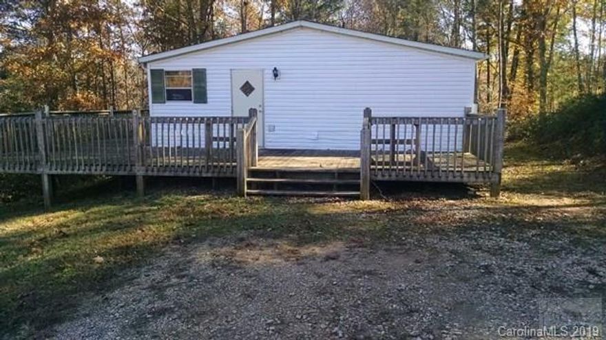 3BR/2BA Manufactured home, eat in kitchen, Large Mst Br and wrap around deck to enjoy nature. All information subject to buyer inspection and verification. Sold AS-IS where is.