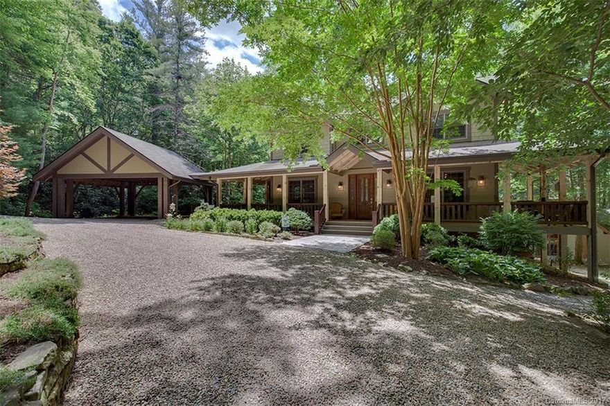 Large home on over 12  acres of usable land with a creek, pond, pasture, outbuildings, camp like setting. Post and beam pavilion with fireplace and grilling area.   Main house has open floor plan, wrap around porch, and post and beam 2 car carport attached.  Custom kitchen with cherry cabinets, open to living and dining room, natural gas range. Office and half bath, breakfast area, pantry off kitchen.  Master suite with cathedral ceilings, large bath, and walk in closets.  Lower level office/BR