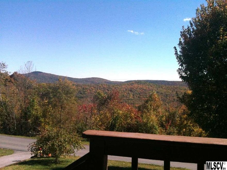 Lovely home with big yard in a neighborhood on a mountain top with VIEWS in a super convenient location with EASY access! Updated, remodeled 3BR/2.5 BA home 1736 +/- sq.ft. first floor with 1736 +/- sq.ft. full, unfinished basement with two car garage. VERY CLOSE TO: hospital, elementary - middle - high schools, town center, shopping. Big yard all around - nearly flat back yard. Paved driveway. Improvements 2013-14 include adding an office, bedroom and half bath, new appliances, new light fixtures, new flooring, painting, new wiring, new atrium doors in dining room, new energy efficient heat pump water heater, landscaping. Beautiful long range mountain views. Pretty neighborhood with well maintained paved streets, community water, community picnic shelter with play fields. Roads and common areas are maintained in park-like condition. Quiet and peaceful - low traffic - about 15 homes - can walk all around neighborhood streets. Sellers lived here year round and loved this community.