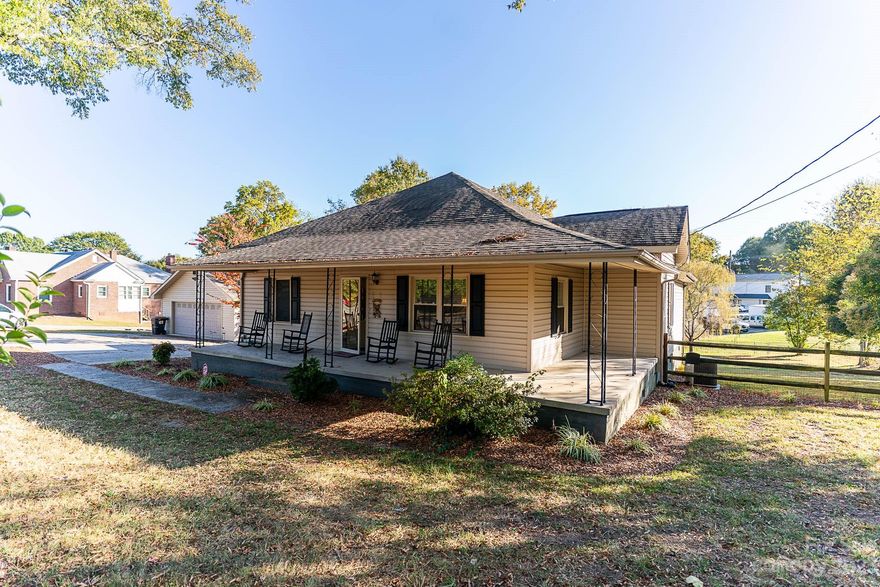 Lovely renovated home with cottage charm on 0.73 acres. Lots of natural wood flooring. Sit in the den/sunroom overlooking the large, fenced backyard - or enjoy nature from the side porch. Beautiful trees provide shade and serenity. Two bedroom suites, one with wood floors, 2 large closets, an large ensuite bathroom with a tub/shower combo AND a separate shower. Second suite with full bathroom as well. The sunny kitchen has lots of cabinets space and a pantry. Enjoy the open dining area and an island with room for stools as well as. The den/sunroom makes a great area for many uses: home office, sitting room, workout room. There's a separate, sunny laundry room as well. Additionally, there is a detached double garage with a deep sink, workbenches and concrete floor which is approximately 24 x 26 ft. Lots of room for hobbies and car storage.