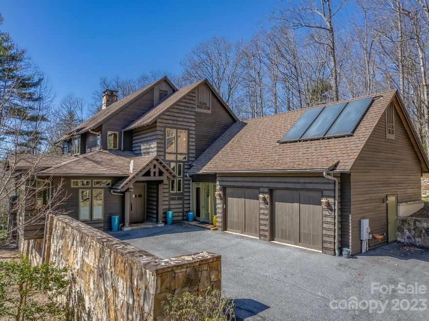 MOTIVATED SELLER! Outstanding craftsmanship in a fabulous private location combined w/ a special blend of clean lines and warm touches of heart pine create a wonderful mountain sanctuary. The open floor plan is perfect for entertaining and allows for one level living for you with 2718sf on the main level. The upscale chef’s kitchen w/ Wolf and SubZero appliances, plenty of richly stained cabinets and beautiful new quartz countertops. The spacious dining area is open to the inviting living room with Rumford stone masonry fireplace plus wood and beamed ceiling. Lovely quarter sawn oak flooring on most of the main. Main bedroom suite w/ access to private patio, a guest suite, office and den/bedroom 3, laundry room and mudroom complete this level. Upstairs has a large guest suite with separate den/office or 4th/5th bedroom. This home offers many options for different lifestyles. Also 2x6 construction, sprayed foam insulation and solar assisted water heater. 8 minutes to Hendersonville.