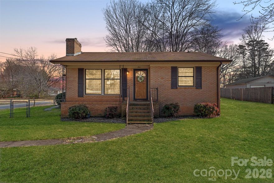 NO HOA! This charming brick ranch sits on a spacious, flat corner lot and offers beautiful hardwoods throughout most of the home, a light-filled living room, and a cozy fireplace that anchors the space. The functional layout provides comfortable everyday living with great natural light and easy flow from room to room. Enjoy a fenced yard area perfect for pets or play, plus a carport and storage shed for added convenience. Crawlspace improvements were completed in 2023; including a new vapor barrier, French drain, etc for added peace of mind. Conveniently located just minutes from downtown Mount Holly’s shops and dining and a short drive to the U.S. National Whitewater Center!