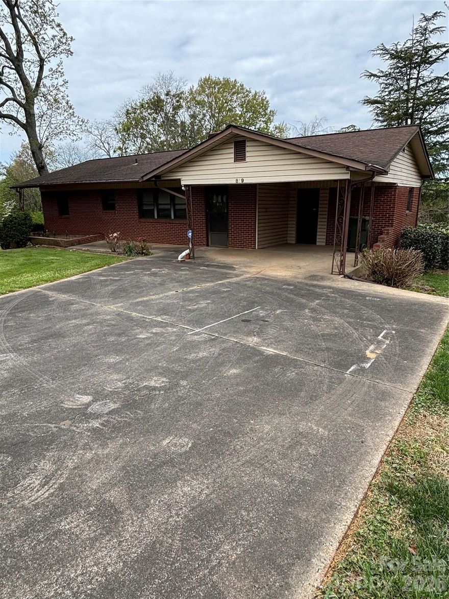 Do you like vintage properties? The look of hardwood floors & walls? The amazing wood inside this home is original from 1960! This 3-bedroom home in Kings Mountain may be the perfect place for you and your imagination. 
THERE ARE 3 LOTS WITH THIS LISTING: Lot the house sits on, a 10' wide lot and a buildable lot about .37 acres.
The main level includes 3 bedrooms, 1 full bath, a spacious living room with a fireplace covered in stone.  The kitchen is just off the living room and easily accessed from the carport. There’s also a ‘bonus’ room that could be used as an office. (Or a room to move the laundry on the main level).
There is a full, unfinished basement that also has a fireplace. Interior access and basement door that leads directly to the back yard. 
Are you a teacher at North Elementary, have a student who attends, or a volunteer at North Elementary? Just walk out the back door of this home and you’ll be there in just a few minutes!
THERE ARE 3 LOTS WITH THIS LISTING: The TOTAL of all 3 is aprox. .72 acre. There is a separate lot included which is about .37 acres.The land is more than you would think. The house and 2 additional lots convey with this property.
Just 2 minutes to Hwy 74, less than 5 minutes to I-85 and just 27 miles to Charlotte Douglas airport.  Home is SOLD AS-IS seller will do no repairs.
Call today for a private showing!!