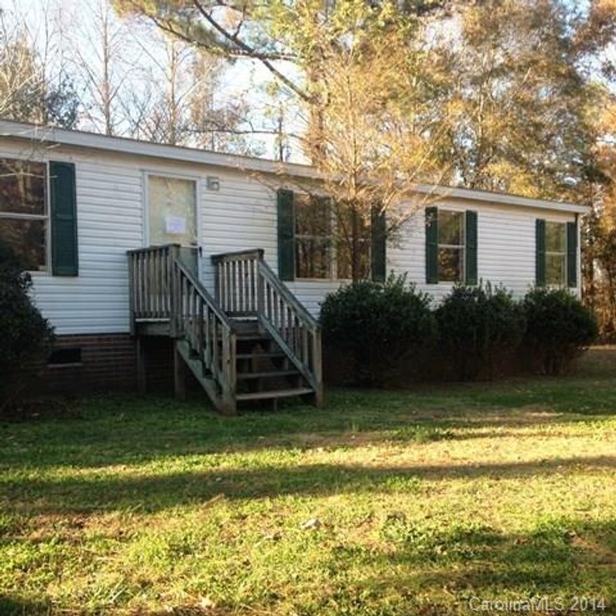 Can you say country living!  Split bedroom doublewide situated on private secluded lot in Chester County, SC.  Less than 5 minutes to I-77, this home features a split floor plan with separate living and den; Large master bath and walk in closet!  This is a Fannie Mae Home Path property.