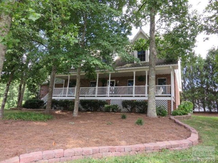 REDUCED $6,000! 313 Springwood Dr NE Valdese - Motivated Seller, great hardwoods shade your welcoming full length rocking chair front porch on this beautiful brick home in the Springwood neighborhood in Valdese.  A warm living room with gas log fireplace invite you in leading to the dining area and kitchen, new kitchen counter top, also on the main level is a main floor master bedroom, a 2nd bedroom, a half bath for guest, garage and rear deck leading to the great side yard.  Do not miss the largest part of this lovely home, just up the stairs are bedrooms 3, 4, & 5 followed by a second bath, an additional office, and large family room over the garage.  Surely you could use a bedroom or 2 for overnight guest?  This home will not last long at this price in this attractive neighborhood.  Convenient to I-40, Valdese, Rutherford College, Morganton, & Hickory.