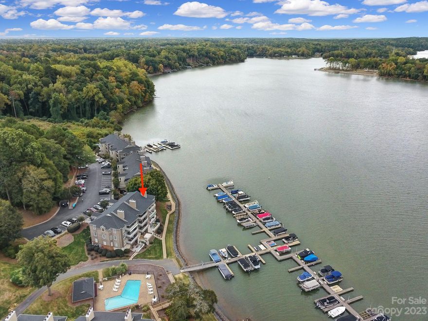 Welcome home to this gorgeous WATERFRONT condo on Lake Wylie! This 2 bed, 2 bath, highly desirable END UNIT with MAIN LEVEL access is located in the beautiful Emerald Point community - said to be the best kept secret on Lake Wylie! Enjoy breathtaking water views from the primary bedroom, living room, and private covered balcony! Open floor plan, stainless appliances, granite counters and ceiling fans throughout, and many recent updates including hvac, tankless hot water heater, windows, lighting, flooring, sinks, faucets, ceramic tile showers w/glass doors, garden tub, paint, Trex decking, etc. Community sits on over 26 wooded acres with more than 1450 feet of water frontage with amenities including swimming pool w/lake view, kayak/paddle board rack storage and launch, boardwalk, and 2 marinas with boat slips for sale or rent to community members as they become available. Located minutes from I-485, restaurants, shopping, entertainment, CLT airport, Uptown Charlotte, etc!