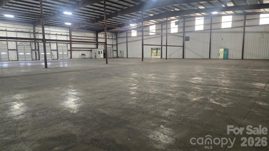 Well-maintained 61,500± SF metal building. The property features a shipping office, restroom facilities, and a layout ideal for manufacturing, distribution, or storage operations.

Property Highlights:
Total Size: 61,500± SF
Ceiling Heights: 24,000± SF with 27' peak height, balance of space with 17' peak height
Construction: Metal building, clean and well-kept

Recent Upgrades:
Dock improvements and gravel parking lot enhancements
Regular roof maintenance
Energy-efficient LED lighting throughout
Utilities: Fully serviced and functional
Site Condition: Phase 1 Environmental Assessment completed and clean
Additional Details:
The property offers easy truck circulation, improved dock areas, and ample parking for employees or fleet vehicles. The combination of clear heights, modern lighting, and convenient highway access makes this an excellent, ready-to-use industrial space for your next operation.

Availability: Immediate occupancy – move-in ready!
