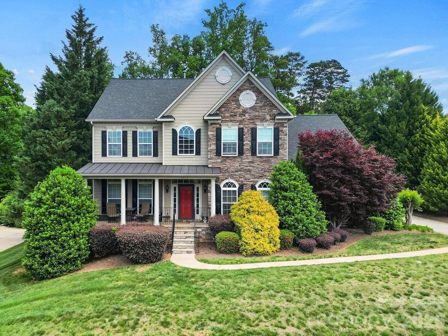 Welcome to this beautifully appointed two-story home in the desirable Lakepoint subdivision of Belmont, where thoughtful design and inviting spaces come together effortlessly in this lake community.

A charming covered front porch sets the tone, offering ample room for rocking chairs - perfect for enjoying quiet mornings or greeting guests with view of the lake. Step inside to a dramatic two-story foyer, flanked by a formal den on the left and an elegant dining room on the right, complete with a contemporary chandelier and classic wainscoting.

At the heart of the home, the stunning two-story great room impresses with floor-to-ceiling windows that flood the space with natural light. A gas log fireplace serves as a warm focal point, while a coffered two-tone ceiling adds architectural interest and sophistication. The open layout flows seamlessly into the kitchen, where granite countertops, a central island with seating, tile backsplash, and electric range create a functional and stylish hub for everyday living and entertaining.

A breakfast bar connects the kitchen to a bright sunroom/breakfast nook - an ideal spot for morning coffee or casual conversation while meals are prepared.

The main-level primary suite offers a serene retreat, featuring a tray ceiling with ceiling fan and a spa-inspired ensuite bath. Relax in the soaking tub, enjoy the convenience of dual vanities, and unwind in the spacious glass-enclosed shower. A generous walk-in closet completes the suite.

Upstairs, double doors lead to a versatile bonus room perfect for a home office, media room, or flex space. Three additional bedrooms and two full baths, including a jack-n-jill bath between two of the rooms, provide plenty of living space for family and guests, with select rooms offering peaceful views of the lake.

Outdoor living is just as impressive. Step onto the patio just off the great room, where a built-in gas grill makes entertaining easy. Spend summer days by the salt water pool with its striking rock water feature, or relax under the Tuscan-style pergola. A thoughtfully landscaped fire pit area invites cozy evenings under the stars.

Other notable features of this home include whole house water filtration system, roof 2019, 2 zone furnace 2025, hotwater heater 2026. 
All of this is just a short drive from Belmont’s charming downtown, offering lakefront dining, shopping, restaurants and a vibrant local scene.