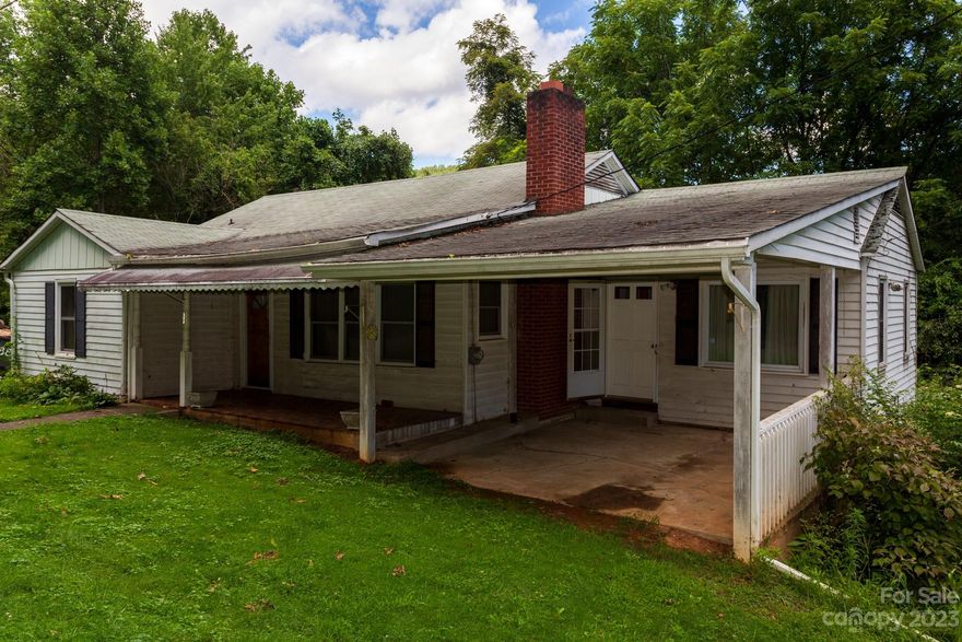 Does your buyer need lots of room?  Does your buyer need a place to work on or park vehicles? Does your buyer play the organ or piano? Does your buyer need a 2 Bedroom 1 bath in Candler?  Does your buyer need to be under $300K?  Well, have I got the house for you!!!!  The house is 1800  plus sf upstairs with an 1800 plus sf full basement.  There is a 1650sf garage which needs some serious attention.  Then there are sheds, porches and a little over 23rds of an acre too.  Dead end street, close to the interstate.  Only $140,000 with no zoning!  Come and see!  Old  piano included!  Below Tax value!!!