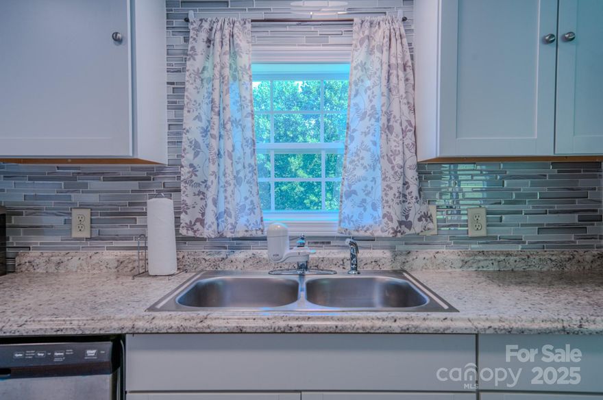 Charming Double-Wide on Half an Acre in Marion, NC
This beautifully updated three-bedroom, two-bath home sits on a spacious half-acre lot, offering both comfort and convenience. Inside, you’ll find a modern kitchen with updated cabinetry, new countertops, and sleek stainless steel appliances. Fresh flooring runs throughout the home, giving every room a bright, inviting feel.
The primary suite features its own private bath, while two additional bedrooms provide plenty of space for family or guests. A level yard surrounds the property, making it ideal for outdoor activities, gardening, or simply enjoying the mountain air.
Located in Marion, this home combines the tranquility of a private lot with easy access to local amenities, shopping, and dining. Move-in ready and stylishly updated, it’s a perfect choice for anyone seeking a comfortable home in a desirable location.