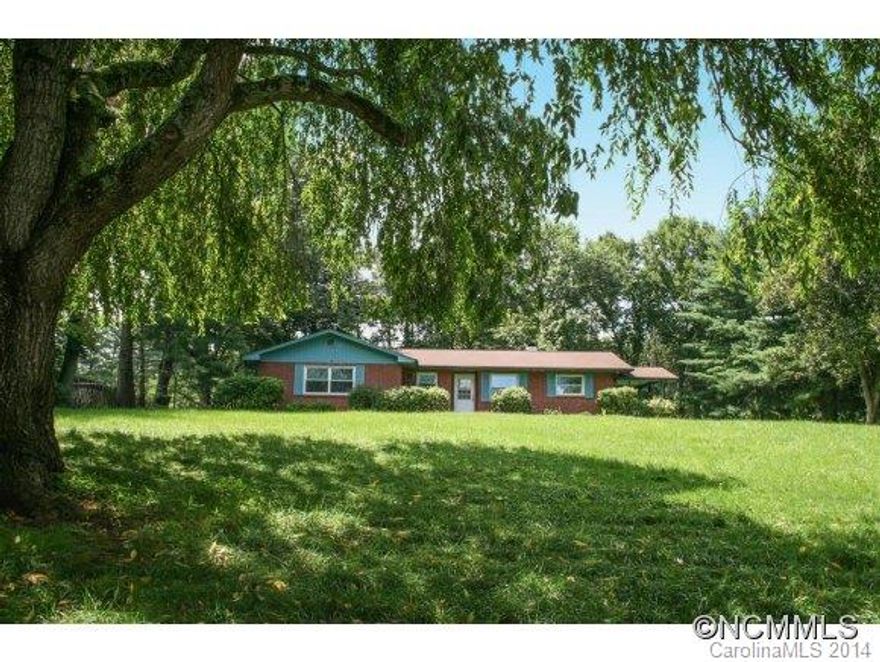 Lots of home for the money in convenient Candler location. Close to I40 and I26 access, but without the road noise, and less than 15 min to downtown Asheville! Vintage home to move in as is or make it more modern w/your updates! Great sized rooms w/lots of light. Beautiful fireplace in living room, & fairly open floor plan for the era. Spacious yard for play or gardening. Master has half-bath. Single car garage in basement. Appraised at 152k.