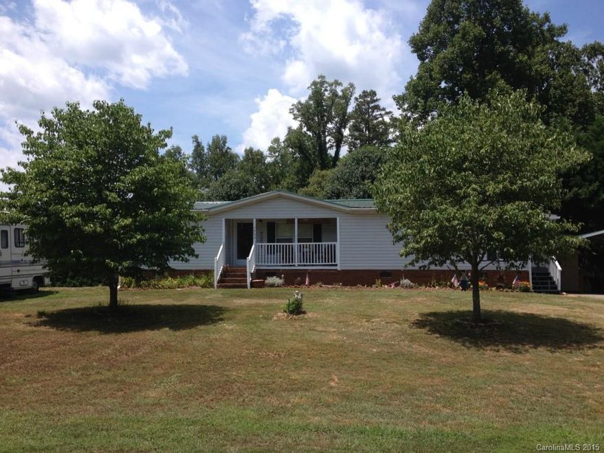EXCELLENT LOCATION, CLOSE TO DINING, SHOPPING, INTERSTATE AND MORE. QUIET NEIGHBORHOOD FOR THIS THREE BEDROOM 2 BATH MFG. HOME.  METAL ROOF, COVERED PORCH ON SIDE AND BACK, BRICK UNDERPINNING, CHARMING BACK YARD W/POND. SPACIOUS LIVING ROOM, OPENS TO LARGE EAT IN KITCHEN, SPLIT BEDROOM FLOOR PLAN. DETACHED CARPORT.