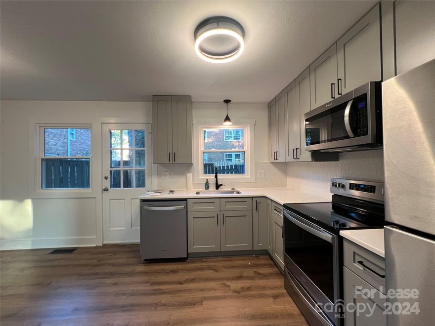 Fully Renovated Townhome/Condo in Downtown Statesville's Historic District. Directly across from the brand new Mitchell Community College would be perfect for a student and roommate! All new cabinetry and vanities with slow close hinges and custom quartz countertops. LVP and Hardwood flooring throughout main areas. Terrazzo tile flooring in both bathrooms. Freshly painted top to bottom. All new stainless Whirlpool appliances. Washer, dryer and Fridge included. Trash/Recycling, Water/Sewer, Lawn maintenance, and pest control all included in rent. Tenant is only responsible for power and cable/internet. Tenants must pay a $45 application fee for any resident over the age of 18.