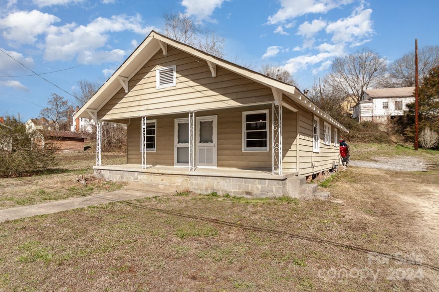 Welcome to this 2/1 that has been updated! New LVP flooring in bedrooms, newer bathroom with tankless hot water heater. Come to the nice front porch and inside you'll find a living room that's open to the eat in kitchen and kitchen. To the left are 2 bedrooms, one which can have separate entrance from porch. Out back is a storage shed that is also the laundry hook up. Stove can be switched to gas as well. Home is being sold AS-IS and owners used it as a rental.