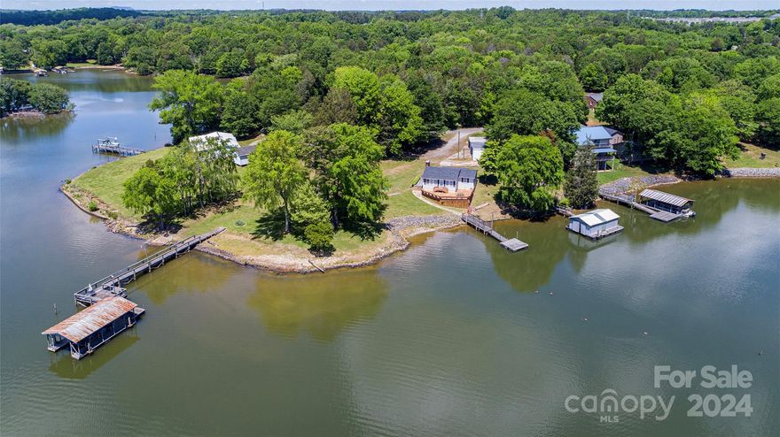 Discover the ultimate lakeside retreat on this expansive 1-acre lot. Embrace the serenity of lake living as you indulge in panoramic views and endless recreational opportunities right from your doorstep. This lot includes a charming 2 BR/1BA lake cabin with rustic aura, multiple piers, and its very own private boat ramp. Plus, with ample land to spare, envision crafting your dream home amidst this stunning natural backdrop. Whether you seek a weekend getaway or year-round sanctuary, this property offers the perfect canvas for creating lifelong memories. Don't let this rare opportunity slip away; claim your slice of lakeside paradise today!