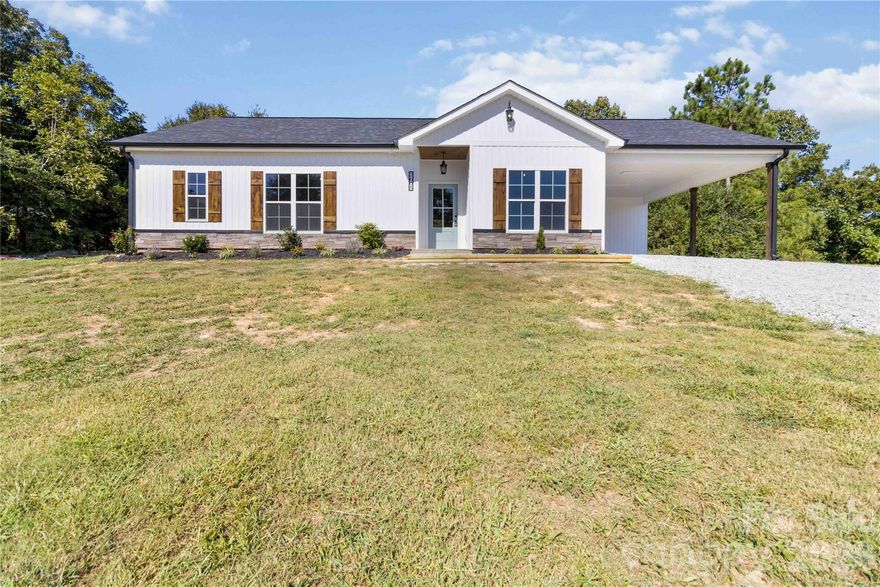 Welcome to this beautiful new construction home offering the perfect blend of modern design and peaceful rural living. Featuring 3 bedrooms, 2 bathrooms, and 1,537 heated square feet, this thoughtfully crafted home sits on 2.237 acres, providing plenty of space and a sense of privacy. The eye-catching board-and-batten exterior adds standout curb appeal, while the covered back porch is an ideal spot to unwind and enjoy the quiet surroundings. Inside, the open, light-filled layout is perfect for everyday living and entertaining. Luxury vinyl plank flooring flows throughout, complementing the bright kitchen with granite countertops, stainless steel appliances, and a spacious design that connects seamlessly to the living and dining areas. The primary suite offers comfort and convenience with a well-finished bath and generous storage. An attached carport adds everyday functionality, and additional acreage may be available for purchase to expand your property. Don’t miss the opportunity to own this brand-new home!