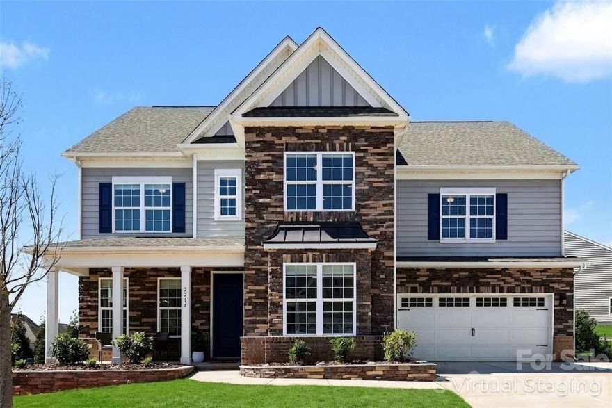 Welcome to this beautifully designed home in the highly sought-after Waterside at the Catawba community in Fort Mill, where stylish living and exceptional outdoor spaces come together. The home features impressive curb appeal with its combination of stone accents, classic architecture, and a welcoming front porch that creates a warm and inviting first impression. 

Inside, the home offers a bright and thoughtfully designed layout with expansive living spaces filled with natural light. The main living area flows seamlessly into the dining space and kitchen, creating an open and comfortable environment ideal for both everyday living and entertaining. Custom built-ins, modern finishes, and large windows enhance the main living areas while maintaining a warm and welcoming feel throughout the home.

A standout feature of the floor plan is the full bedroom and full bathroom located on the main level, providing excellent flexibility for guests, multigenerational living, or a private workspace. Just beyond the main living area, a heated and cooled sunroom offers a beautiful year-round retreat with walls of windows overlooking the backyard and pool, creating the perfect space to relax while enjoying the natural light and outdoor views.

Step outside to a backyard designed for entertaining and relaxation. The private in-ground pool is surrounded by a large patio with plenty of room for seating, dining, and enjoying warm Carolina days. The outdoor space feels like a personal resort, making it ideal for gatherings or quiet evenings by the water.

Residents of Waterside at the Catawba enjoy access to an impressive range of neighborhood amenities including a clubhouse, fitness center, outdoor pool, playground, tennis courts, scenic ponds, sidewalks, and walking trails throughout the community. Located in Fort Mill, the home also benefits from highly regarded schools and convenient access to nearby shopping, dining, and the greater Charlotte area, offering the perfect blend of comfort, lifestyle, and location.