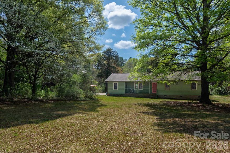 Almost 5 acres in Wesley Chapel, truly a rare find in this growing and popular area.  Enjoy the conveniences of nearby shopping and restaurants whilst enjoying the acreage and privacy this home provides for all your hobbies.  Move-in ready home with LVP flooring-no carpet in home, natural light and cheerful decor, kitchen with bayed breakfast nook, vaulted ceiling in living room, wood burning fp, Bonus! refrigerator, washer and dryer to remain.  Move-in ready home empowered with the potential for your dream setting; perhaps a large garden, hobby farm, a couple horses or barndominium, the choice is yours and the possibilities are endless!  Transferrable termite bond.  Updates include roof (2015), hvac (2025), water heater(2018), crawlspace has had a complete transformation and is in excellent shape with new vapor barrier and new insulation and no worries for a the new homeowner!  Don't wait on this one!  No HOA.