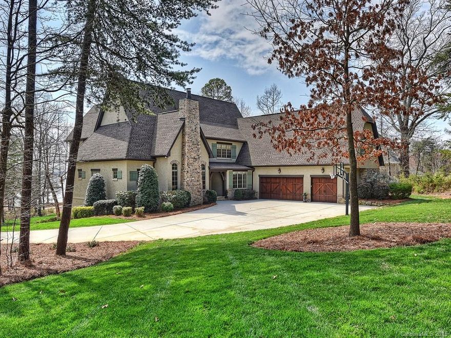 Large, private 1.46 acre golf course lot with amazing views of 16th green & Lake Norman. Boat Slip less than 1 block away. Unfinished walk-out lower level has 2969 sq. ft. just ready for you to design & finish! Open floor plan. Oversize secondary BRs each with full bath.  Fireplace in Study & Great Room. Covered patio, dual staircases, huge drop zone, Laundry rms on both 1st & 2nd Floors. 2 additional "flex" rms for exercise, play or hobby. You won't believe the water views!  Room for a pool.