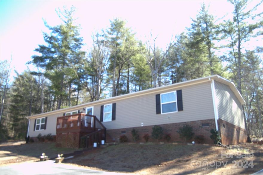 Extra Lot Included and Move In Ready! 1800 + Sq Ft, 3 Bedrooms plus Bonus Room, 2 Bth Home is your opportunity to claim spacious comfort, inside and out!  Desirable open concept offers both a living room and family room or den, with a large, centered kitchen boasting abundant cabinet area plus additional space with the kitchen island.  Add an attractive dining area and you’re ready to host large family gatherings and entertain with pleasure.  Convenient, large mud/laundry room with extra space for freezer or fridge.  Smart, desirable split bedroom plan affords added privacy and includes a primary suite w/ private bathroom and large walk-in closet.  2 additional bedrooms plus a bonus room share the 2nd full bath.  Front deck overlooks the sprawling lawn and extended distant views. Wired, detached garage does double duty as a great workshop area.  2 lots to protect your privacy and a home offering exceptional space and value.  Is this the one to finally fulfill your wants and needs list?