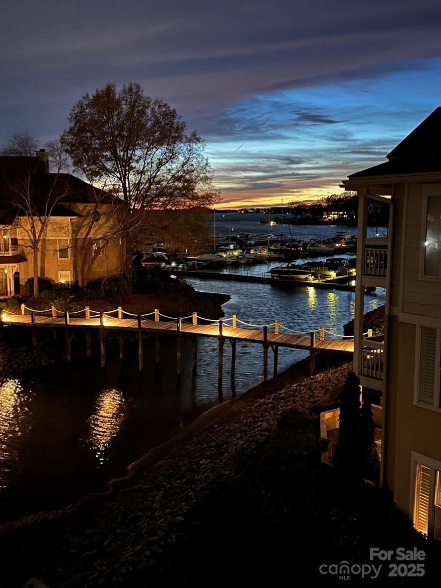 Charming updated waterfront end unit penthouse condo. Enjoy waterfront sunset views all the way to Denver from the west facing private deck. Just steps from adjacent Safe Harbor Marina and Carefree Boat Club! This condo features ss appliances, windows of sweeping natural light, vaulted ceilings, exquisite wood floors and a cozy fireplace. The spacious open floor plan includes a large primary bedroom with stunning waterfront views, direct deck access and en-suite bathroom featuring attractive dual farm sink vanities and tiled shower. Take a stroll around the Kings Point waterfront pathways. Beautiful waterfront views and scenery abound. Enjoy outdoor living at the lakeside community pool or on your private deck perfect for entertaining or relaxing. Easy access to Jetton Park and local greenways. Easy access to shopping, dining, and entertainment at nearby Birkdale Village. Conveniently located near I-77 and Hwy 16 providing quick access to Charlotte or the NC mountains. NEW HVAC 2021.