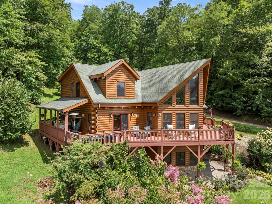 OPEN HOUSE Sunday, May 17.  2-4 pm.  Showings available by appointment with 24 hour notice after 4/17. Nestled within the gated community of Cobblers Knob, this handcrafted cabin is a true gem that beautifully marries rustic charm with elegant living. Once inside, you're greeted by the warm embrace of natural wood beams and rich, handcrafted finishes. The grand stone fireplace serves as the heart of the living space, inviting you to unwind. With ample natural light streaming in through large windows, the open floor plan is spacious and airy. On the main level, an expansive deck offers stunning views of the surrounding landscape, perfect for morning coffee or evening stargazing. The kitchen features granite countertops, breakfast bar and stainless steel appliances. The primary suite is a luxurious retreat, featuring a jetted tub and a tiled custom shower, offering a spa-like experience. Venturing upstairs, you’ll find a game room loft space designed for versatility. The lower basement level provides true bonus space. In addition, the property includes a two-car garage with additional finished square footage above. This area is perfect for working remotely or a flexible space. Landscaping. Sellers offering $5,000.00 flooring allowance.