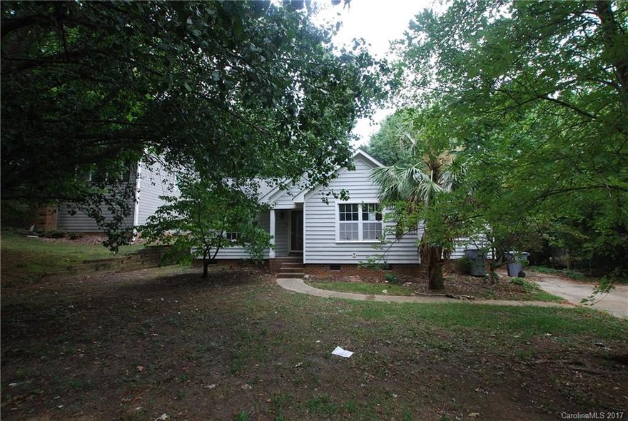 Wonderful open floor plan!  Eat-in kitchen! Great room with vaulted ceiling and ceiling fan, wood burning fireplace. Bar seating at pass thru to great room.  Master suite with private en suite bath and walk-in closet. Two guest rooms share a hall bath!.  Screen porch and deck out back overlook private back yard.Floors have been taken down to sub-flooring. Electrical seems to have an issue but power is on to the house.