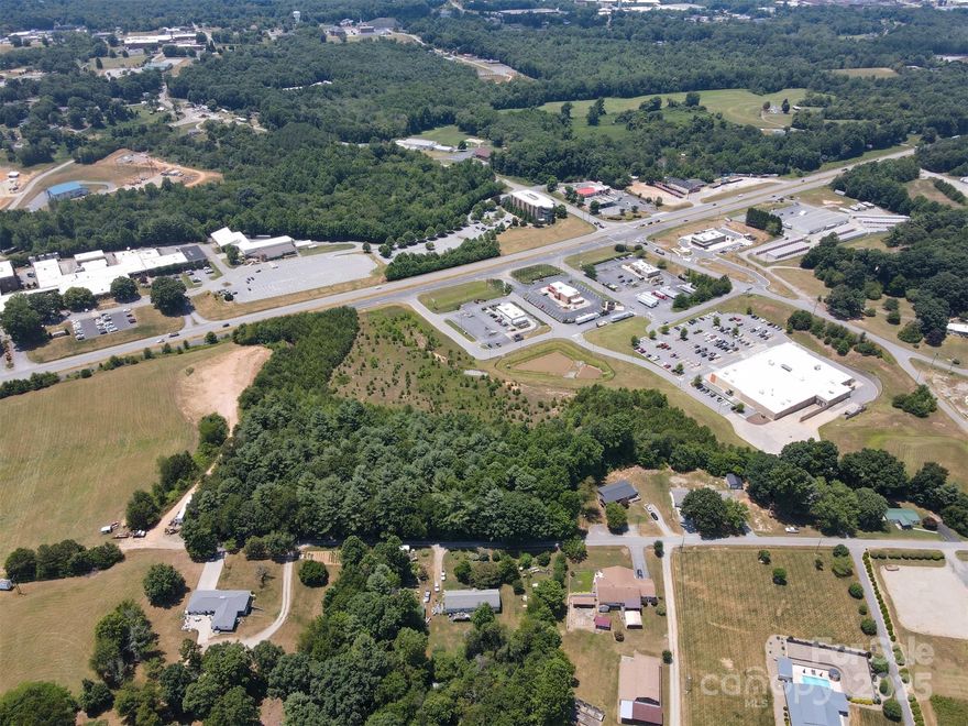 Great opportunity for a developer commercial or multi-family to come in and build next door to a Walmart center.  Fast food on the outparcel lots and plenty of traffic counts on the main thoroughfare from Hickory, NC to Lenoir, NC and beyond to Blowing Rock and Boone.  Four lane highway with a traffic light in front of the Walmart center. Public utilities available. Site is leveled and prepped.  Lots of visibility and access along with the cross access from Walmart and the other outparcel lots.