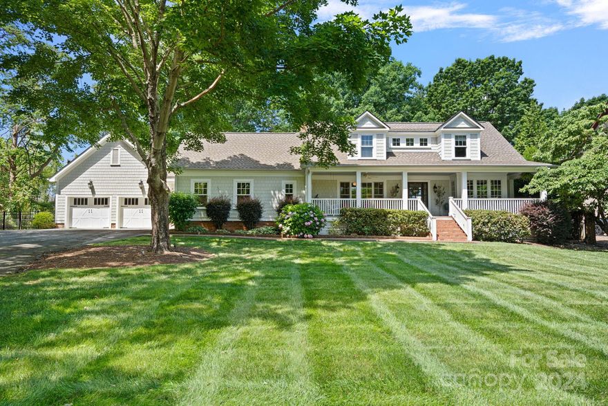 Picturesque Cape Cod on .72 acres in lake access community with 3 car garage! Recently renovated in 2021 to add an additional 2nd primary suite on the main, laundry, mud area and garage. This incredible home offers a gourmet kitchen w/ custom cabinets by Savoy Construction, white marble countertops, Sub Zero built in refrigerator, Wolfe appliances and a large kitchen island accentuated with a black walnut countertop. Striking Australian Cypress and Brazilian Cherry floors complement the real wood beams, trim and molding throughout. This home is perfect for a quiet evening on the large rocking chair front porch or entertaining on the screened in porch overlooking the huge fenced in backyard w/ pool, hot tub, stone fireplace and built-in gas grill with beverage fridge. Don't miss the community beach, boat launch, picnic tables and fire pit. Incredible location, within walking distance to The Peninsula Club and Jetton Park, minutes to I-77 and Birkdale Village. Roof replaced in 2022