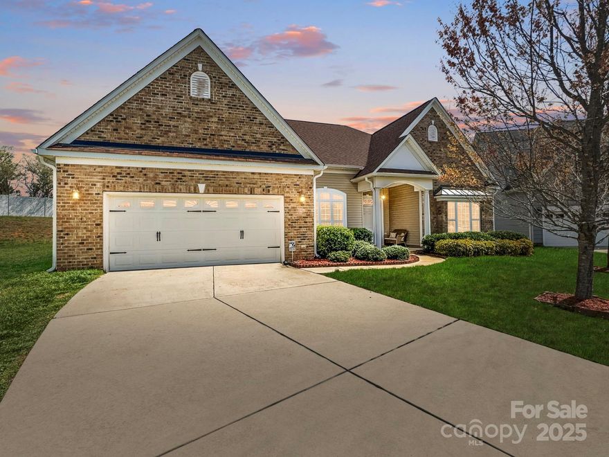 Nestled on a .42-acre cul-de-sac lot in The Gates community, 7371 Vanguard Court offers thoughtfully designed living space with 3 bedrooms and 2.5 baths. This home features a brick veneer exterior, a spacious and functional layout, home office and a raised hearth gas fireplace that serves as a beautiful focal point in the living area. The garage was extended during construction to accommodate a workshop, providing additional storage and workspace. A new roof was installed in the spring of 2022, offering durability and long-term peace of mind. The Gates community offers exceptional amenities, including an outdoor pool, picnic area, playground, recreation area, sidewalks, and street lights. Conveniently located near grocery stores, restaurants, and entertainment, this home provides both comfort and accessibility in a highly desirable neighborhood.