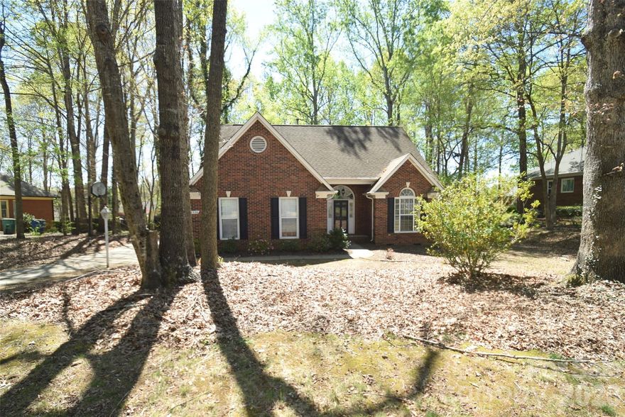 Welcome to your beautifully designed 1.5-story home offering both comfort and character! Featuring all stainless appliances and washer/dryer.  A dedicated office and a spacious sunroom with custom built-ins, this home is perfect for both work and relaxation. The inviting family room features a fireplace, while the primary suite on the main level includes a generously sized bathroom for your retreat. Upstairs, a charming catwalk overlooks the family room, adding architectural interest and an open feel. All bedrooms are equipped with ceiling fans for year-round comfort. Step outside to enjoy a large deck and expansive yard shaded by mature trees—ideal for entertaining or unwinding in your own private oasis. The home comes with a warranty with First American for your peace of mind.