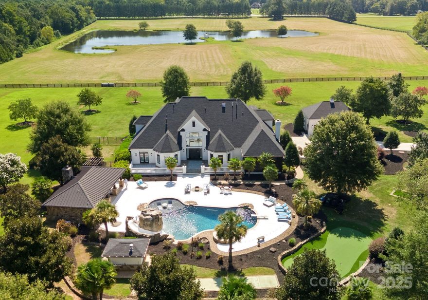 A rare opportunity to own one of the region’s premier luxury equestrian estates, set on 43+/- private acres just minutes from Charlotte. Behind a coded gated entrance, a winding drive opens to a completely remodeled over 6,000 sq. ft. residence, multiple barns, and resort-style amenities—crafted for both refined living and equestrian pursuits.

The main home was extensively updated in 2023 with thoughtful attention to every detail. Exterior improvements include a new roof, fresh stucco finish, a new concrete driveway, repaired and painted roofs on all outbuildings, and fully updated fencing with added aluminum sections. Inside, the home has been transformed with new hardwood floors, custom molding, designer lighting, new countertops, modern appliances, spa-like bathrooms with re-tiled showers, a steam unit in the primary suite, and an expanded walk-in closet. A custom dog shower brings convenience, while mechanical upgrades such as all-new AC units with ductwork, foam insulation, a water-softening system, endless water heater, and a fully encapsulated crawl space with humidifier provide lasting comfort. Outdoor living was also reimagined with a re-plastered pool and new automated equipment, a built-in grill, enhanced drainage and landscaping, and the addition of new exterior lighting and a comprehensive camera system.

Elegant living spaces feature a home theater, chef’s kitchen, and generous walk-in closets—designed for both comfort and practicality.

The grounds elevate everyday living with an in-ground pool and spa featuring waterfall and slide, a covered outdoor pavilion with bar and grill, and a private putting green. A stocked 5-acre pond offers a serene setting for fishing or quiet reflection.

Equestrian facilities are turnkey with an 8-stall barn including lounge, bathroom, grooming/wash bays, and a 20-ft breezeway, plus fully fenced pastures and scenic riding trails. An attached 3-car garage with built-in bar, detached 3-car garage. Every aspect of this estate has been carefully modernized to provide privacy, security, and effortless luxury. For those seeking additional acreage, an adjacent 71-acre parcel with hay barn is also available.

Minutes from Charlotte yet a world away, 315 Brief Road offers the ultimate combination of equestrian lifestyle, modern amenities, and timeless appeal—more than a home, it is a legacy estate.