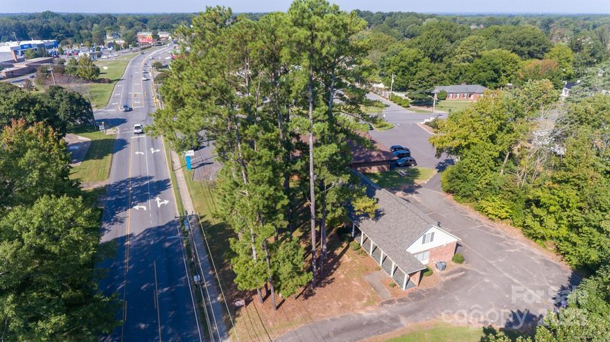 Exceptional opportunity to own a highly visible commercial property in one of Kings Mountain’s busiest corridors. Located on West King Street, this property offers outstanding frontage, excellent traffic counts, and convenient access points that make it an ideal choice for medical, professional, or service-oriented businesses.

Built in 1964, the building features 1,750 sq. ft. on the main level plus 350 sq. ft. of finished space upstairs. The flexible floor plan can be adapted to a wide range of uses. The main level was previously designed for medical office operations, offering multiple rooms, reception, and workspace areas. Upstairs, the finished space includes plumbing connections, making it well-suited for an additional office, staff breakroom, or storage.

The site offers dual access points: a paved entrance from King Street that leads to a private rear parking lot, and a secondary access route from Country Club Road. This ensures easy ingress and egress for staff, clients, or customers.

Highlights include:

-Prime commercial location with excellent road frontage on West King Street
-1,750 sq. ft. main level + 350 sq. ft. finished upstairs
-Upstairs space includes plumbing; suitable for office, breakroom, or storage
-Former medical office with adaptable layout for many business types
-Paved front entrance and private parking lot
-Additional access from Country Club Road
-Just minutes from downtown Kings Mountain and major thoroughfares

This property combines visibility, functionality, and convenience in a single location. Businesses seeking a professional setting with high exposure and ample on-site parking will find this property an ideal fit.