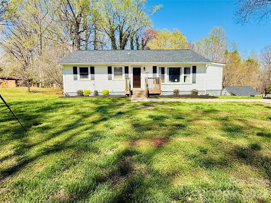 If you’re searching for a charming, low-maintenance home with ample outdoor space for recreation or gardening, this property is an excellent fit. Enjoy peaceful views and quiet surroundings from the back deck overlooking 5 unrestricted acres, all with no HOA restrictions. Offering a newer roof (2024), new LVP flooring throughout the main living areas & bedrooms, updated bathroom & kitchen with stainless steel appliances, quartz countertops, and tasteful fixtures are just some of the features that make this house stand out. The oversized laundry room/pantry offers incredible flexibility and could easily be converted into a third bedroom, home office, or even an additional bathroom—giving you options to grow with your needs. The full walk-out basement with interior access is a blank canvas ready for your personal touch and offers a tremendous amount of space (includes a warranty for recent foundation work completed). The owners have enjoyed this space so much!  All kitchen appliances, washer/dryer, 12X12 chain link dog lot, brand new wooden outdoor play set and separate storage building to convey as well!