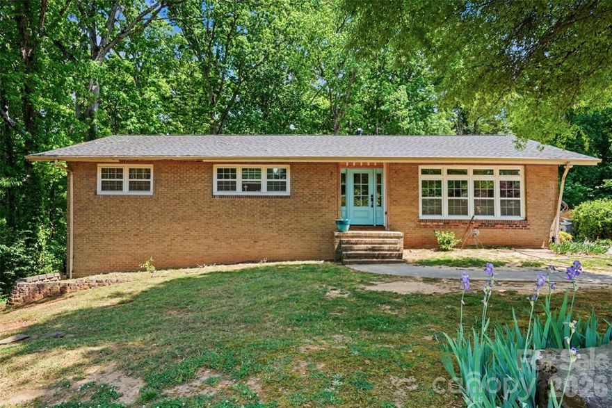 Sought after Lansdowne awaits! Nestled on a spacious, private 0.49-acre lot, a rare opportunity presents itself to renovate and make it your own or build your dream home. This full brick ranch with a walkout basement offers 2,428 square feet of comfortable living space and is brimming with potential. The main level features 3 bedrooms, 2 full bathrooms, hardwood floors, and a living and dining room filled with natural light. The basement includes a laundry room and half bath, with plenty of flexible space to suit a variety of needs. Known for its beautiful tree-lined streets and convenient location near shopping and dining in SouthPark, Matthews, and Cotswold, Lansdowne is one of Charlotte's most admired neighborhoods. Just minutes from Lansdowne Elementary and Providence Day School and situated within the private school corridor. This home is being sold in as-is condition.