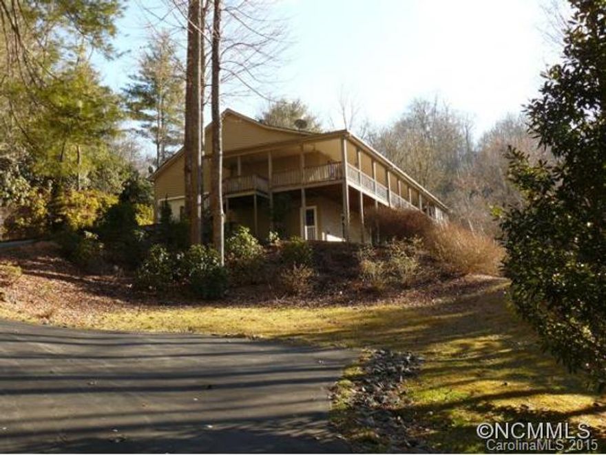 Immaculate, light filled home on private 3.7 acres.  Lot with bold creek and waterfall.  Just minutes from downtown Brevard.  Chefs kitchen includes custom cabinets and granite countertops.  Huge master with plenty of closet space.  Large lower area with office and full bath.  Heated workshop and generator.  13' x 19 dining room/sun porch.