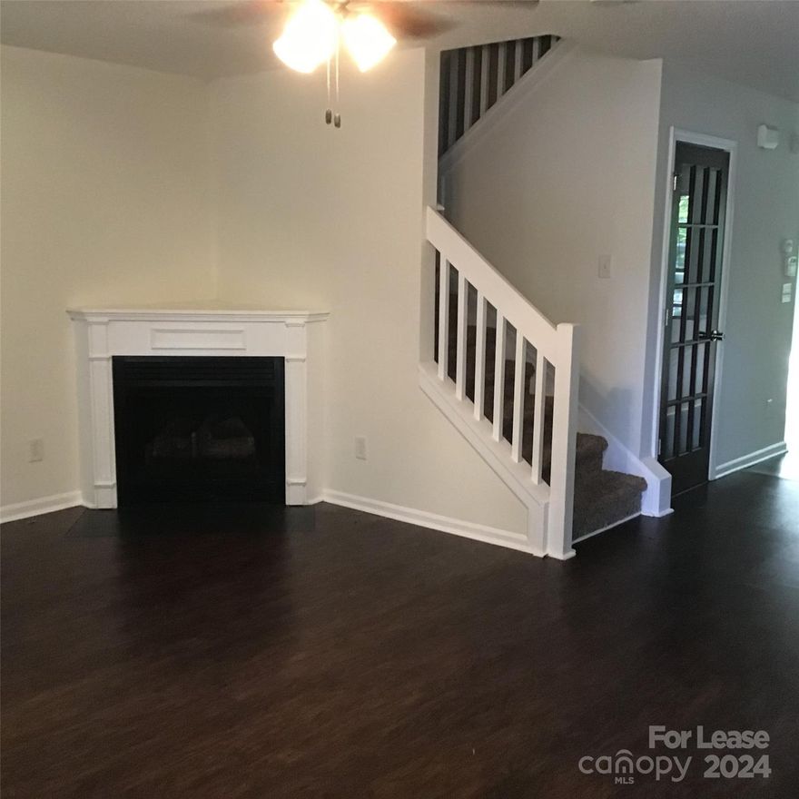 Unique two-story townhome with basement in Windsor Trace! This low-maintenance find has an open floor plan and boasts a fireplace in the living room, kitchen with granite countertops, and laundry room! Sliding glass doors in the kitchen open to a brand-new deck with wooded view. Two bedrooms with two full bathrooms on top floor and two bedrooms with one full bathroom on basement floor. Two parking spaces and use of the community pool included.