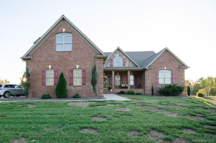 This house has it all!  Brick house in North Lincoln/Pumpkin Center school district with an outdoor fireplace, fenced yard, walk in closets in ALL bedrooms, detached HUGE garage/workshop with nearly 1000 square feet, soaring ceilings, granite, hardwoods, security system, tankless hot water heater, large covered patio and so much more. You must see to appreciate!