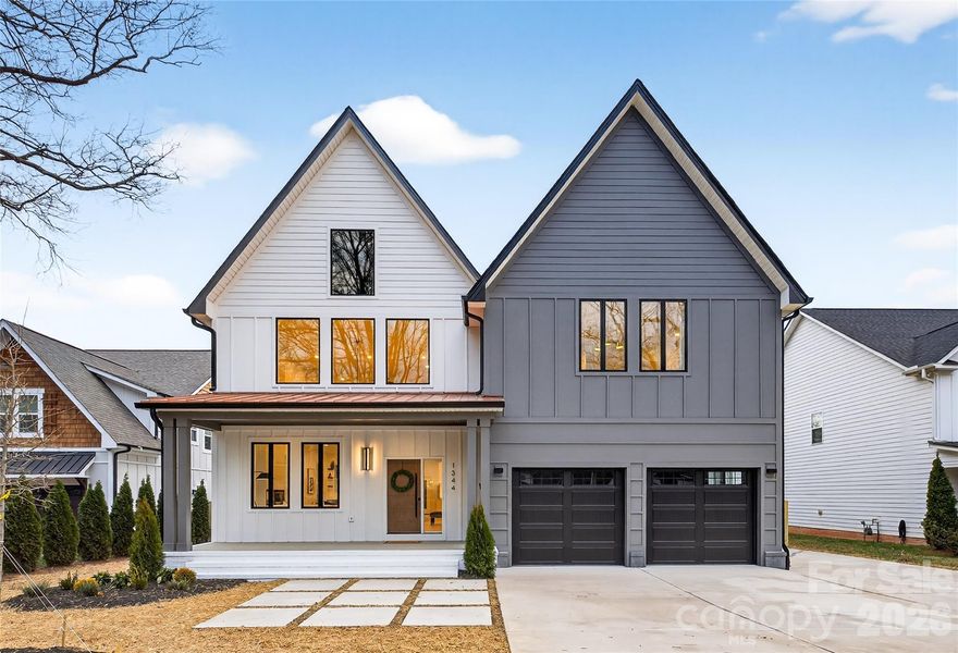 Step into modern elegance with this brand-new 5-bedroom, 4.5-bath home in the highly desirable Cotswold neighborhood, known for its charm, convenience, and proximity to Uptown Charlotte, parks, shopping, and dining. From the copper-accent roof and welcoming rocking-chair front porch to the extra-wide driveway with ample parking and a formal two-car garage, this home combines style and function. The fully fenced, private backyard with a large deck featuring composite decking offers an ideal space for entertaining, outdoor living, or relaxing.

Inside, an inviting living room and foyer with soaring 20-foot vaulted ceilings create an open and airy atmosphere. Thoughtful design flows throughout, including two electric fireplaces, a main-floor guest room that could double as a master suite, and a dedicated office. Custom closets with built-ins and high-end finishes provide both beauty and convenience.

The gourmet kitchen is a centerpiece, featuring a large waterfall island with sink, an additional bar sink on the peninsula, quartz countertops, gas range, and French-door refrigerator, seamlessly connecting to the dining and living areas for effortless entertaining. The primary suite offers a spa-like retreat with a freestanding tub, zero-entry shower, and elegant finishes, providing comfort and style.

Additional features include high end LVP flooring throughout, a Navien gas tankless water heater, and a 30-year architectural shingle roof, ensuring durability and modern functionality.

Located in one of Charlotte’s most sought-after neighborhoods, this home offers easy access to local restaurants, shopping, parks, and top-rated schools, making it ideal for families, professionals, or anyone seeking a perfect blend of luxury, convenience, and lifestyle. With high-end finishes, thoughtful design, and turnkey appeal, this property is a fantastic opportunity to enjoy Cotswold living in the heart of Charlotte. Schedule your showing today!