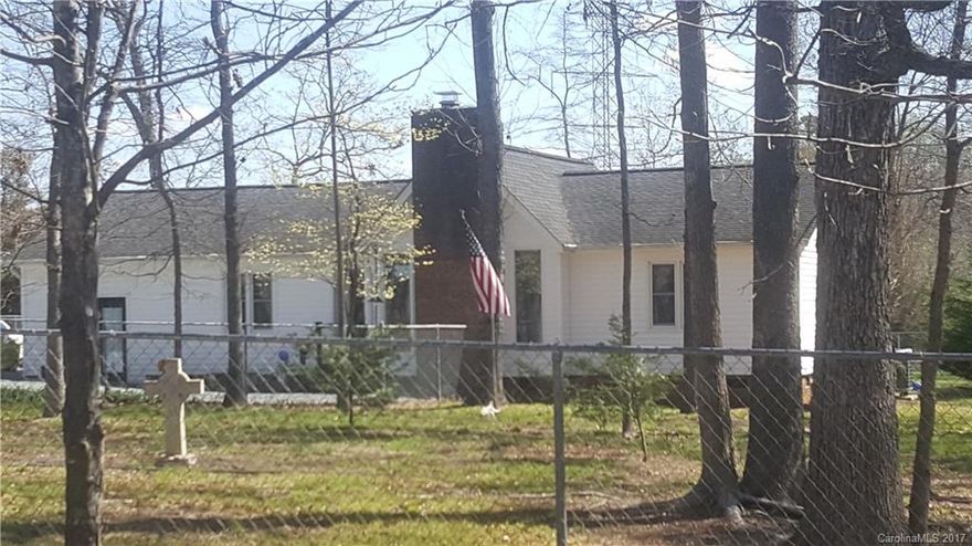 Well maintained 3 bedroom 2 bath house with a bonus room!  This home is situated on over an acre of land and has a completely fenced in yard!  Your fur babies can roam the yard or use the kennel for added security. The back yard boasts 2 Storage Sheds and a nice patio for enjoying your morning coffee.  Enjoy that country feeling while only having a short drive to shopping, dining and entertainment.  And best of all.....NO HOA.